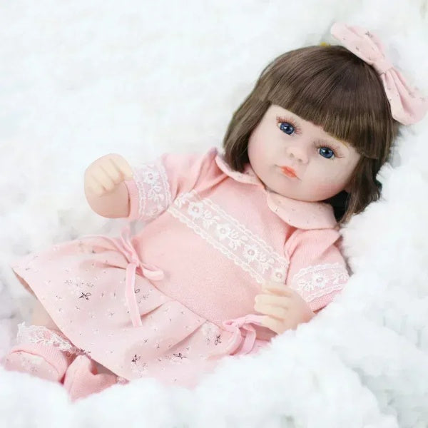 Boneca Realista Bbr Toys Com Lacinho Rosa